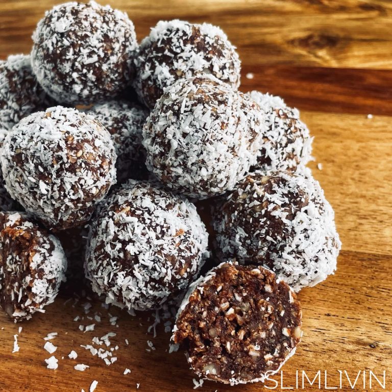 Chocolate Date and Almond Bliss balls on a wooden board