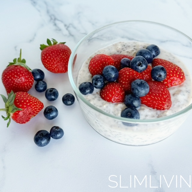 Creamy Vanilla and Berry Overnight Oats in a glass bowl